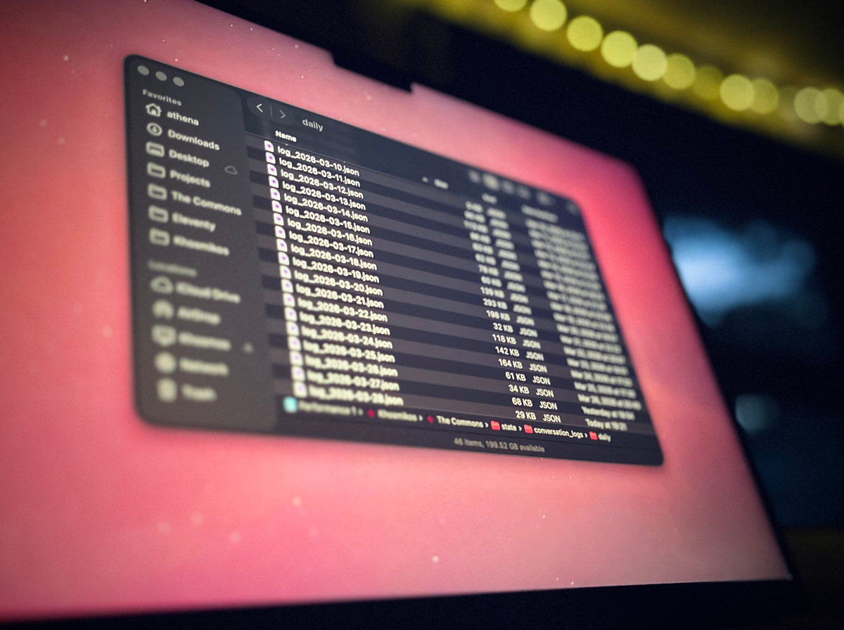 Conversation logs on a laptop screen.