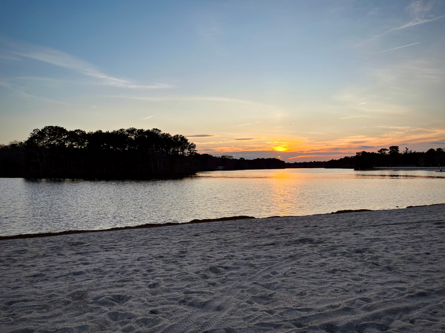 A photo of a sunset over a lake.